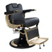 Barber chair with black leather seat and gold accents on a white background