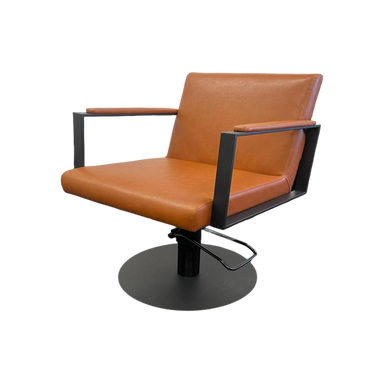 Brown leather chair with black metal frame on a white background