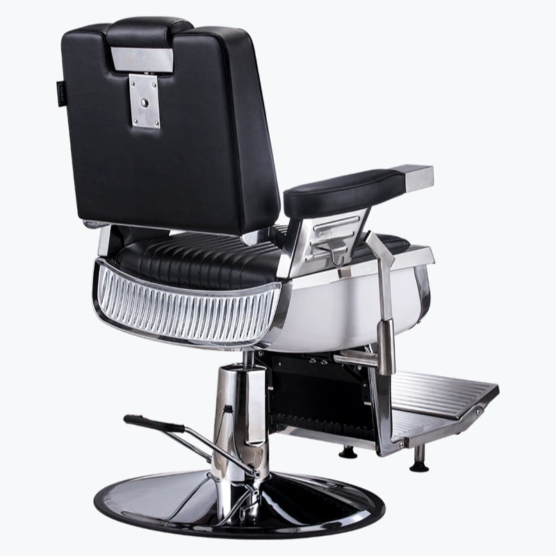Barber chair with black seat and backrest on a white background