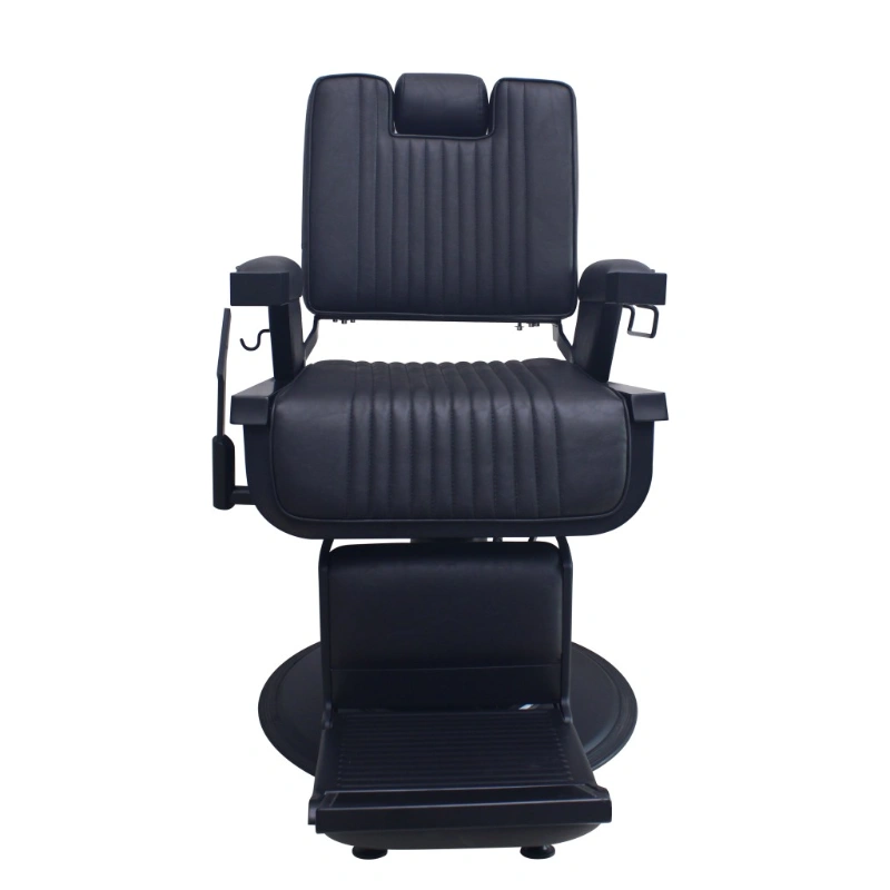 Black barber chair with headrest on a white background